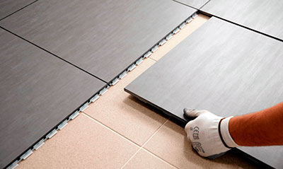 Laying tiles on tiles: real savings or hidden risks?